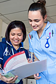 Hospital nurse training a student