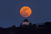 Supermoon over windmill