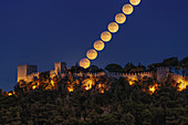 Harvest Moon over castle, time-lapse image