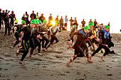 Triathlon Swimmers Run to Ocean