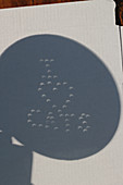Pinhole projection of solar crescents during eclipse