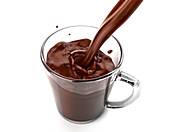 Liquid chocolate pouring into a glass mug, illustration