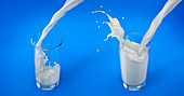 Pouring milk into glasses with splash, illustration