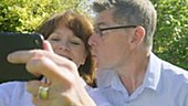 Couple posing and taking photos