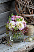 Bouquet of chrysanthemums, elderberries and virgin in the green