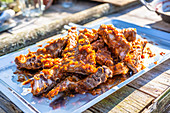Cooked spare ribs marinated with BBQ sauce