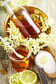 Homemade elderflower syrup in preserving jars