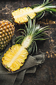 Pineapples, whole and halved
