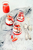 Small desserts with yogurt strawberry mousse and chocolate glaze