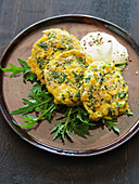 Amaranth and corn fritters with rocket