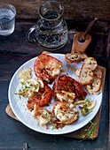 Grilled prawns with grilled bread and lemons