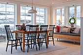 Dining table, chairs and sofa in conservatory