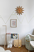 Mountain chain drawn on wall with washi tape in child's bedroom