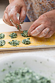 Spinach and ricotta ravioli being made