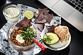 Vegetarian chilli with nachos, lime mayonnaise and avocado