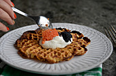 Waffels with celery, rum, sour cream and chive