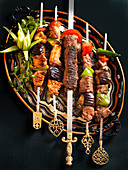 Lamb and chicken skewers with vegetables