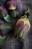 Artichokes on a fabric surface