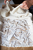 Homemade chestnut pasta drying on a cloth