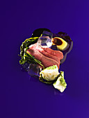 Lamb with iced olive oil and balsamic cubes (molecular gastronomy)