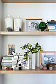 Vases, photos, books and other decorative items on shelves