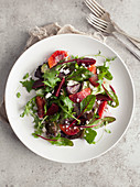 Blood Orange, Beetroot and Goat's Cheese Salad on Grey Background
