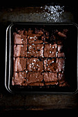 Brownies on a baking sheet, sliced