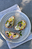 White bread with butter and edible flowers