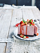 Vegan strawberry brownie cheesecake