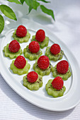 Fruit tapas: kiwi slices with raspberries