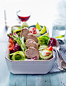 Summer salad with grilled pork tenderloin