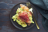 Scrambled eggs with smoked salmon and beetroot sprouts