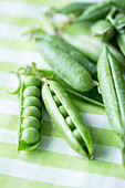 Whole pea pods being prepared for cooking