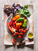 Ingredients for a smoothie (tomato, peppers and basil)