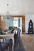 Set dining table below chandelier in classic living room