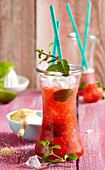 Mojitos with strawberries, strawberry syrup and crushed ice