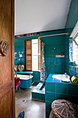 Creative, artistic bathroom in shades of aqua blue