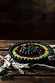 Spinach tart with raspberry jam, blueberries and mint