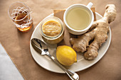 Ginger tea remedy with whole lemon and ginger root