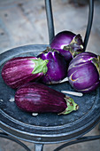 Aubergines on a vintage chair