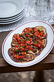 Aubergines with tomatoes and oranges