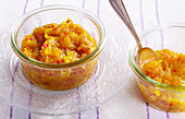 Tangy peach chutney in glass bowls