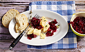 Red onion jam with red wine served with hard cheese