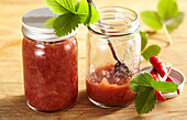 Savory chutney with strawberries, chili and Malabar pepper in glass jars