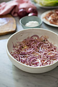 Marinated red onions in a bowl