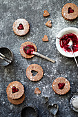 Linzer cookies made of hazelnut dough with raspberry jam