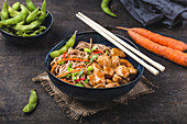 Soba noodles, teriyaki sauce chicken, edamame beans, sesame, chopsticks