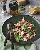 Veal carpaccio with arugula and parmesan cheese