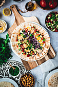 Sabich - Israeli street food in pita on a wooden board