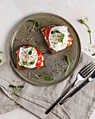 Bruschettas with cream cheese, salmon and poached eggs